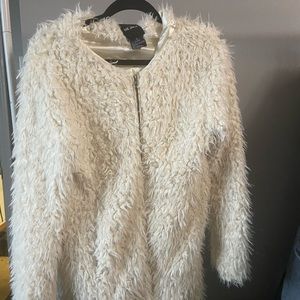 Very cozy off white faux fur coat, with silk lining